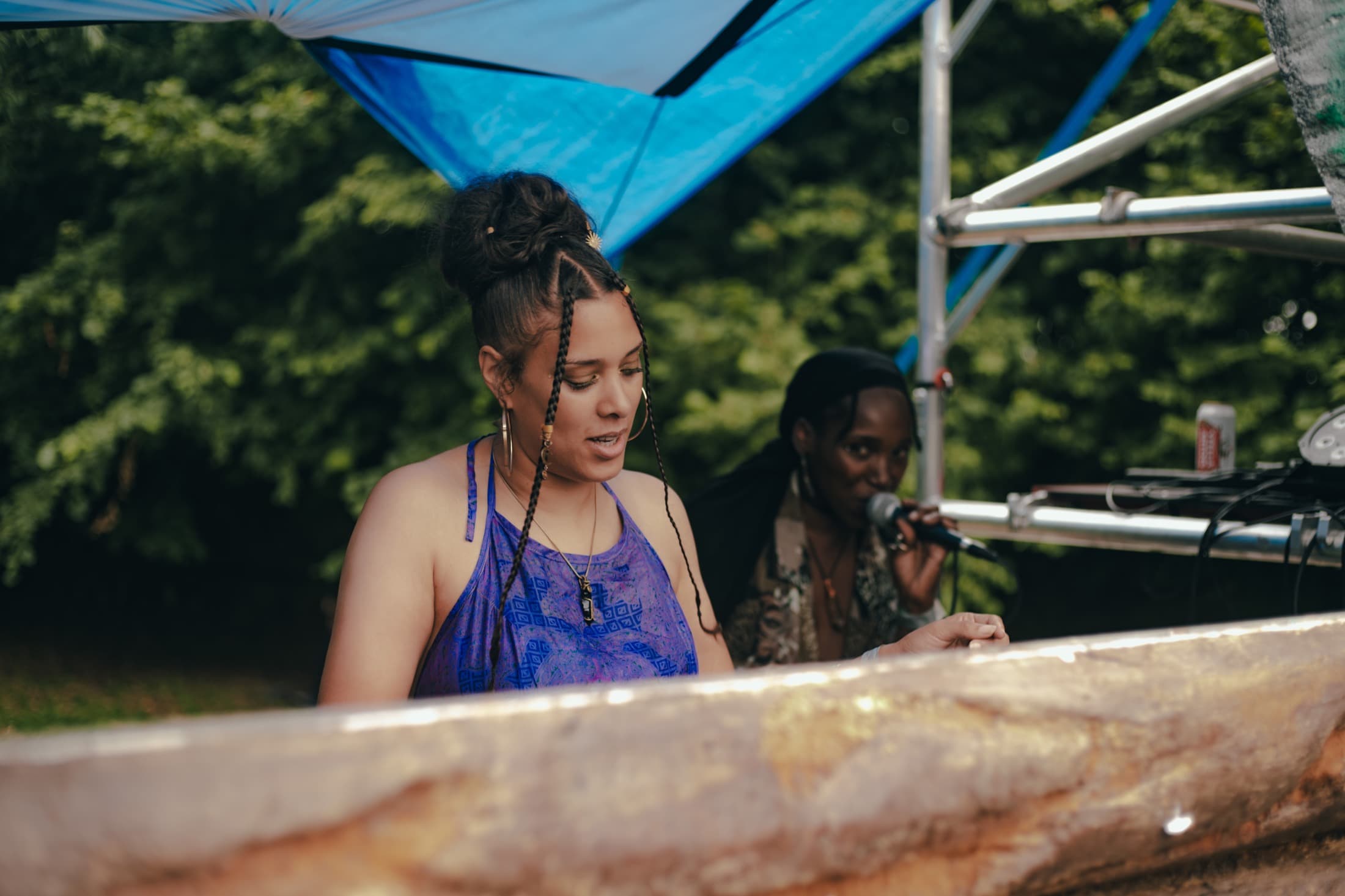Artists performing on an outdoor festival stage