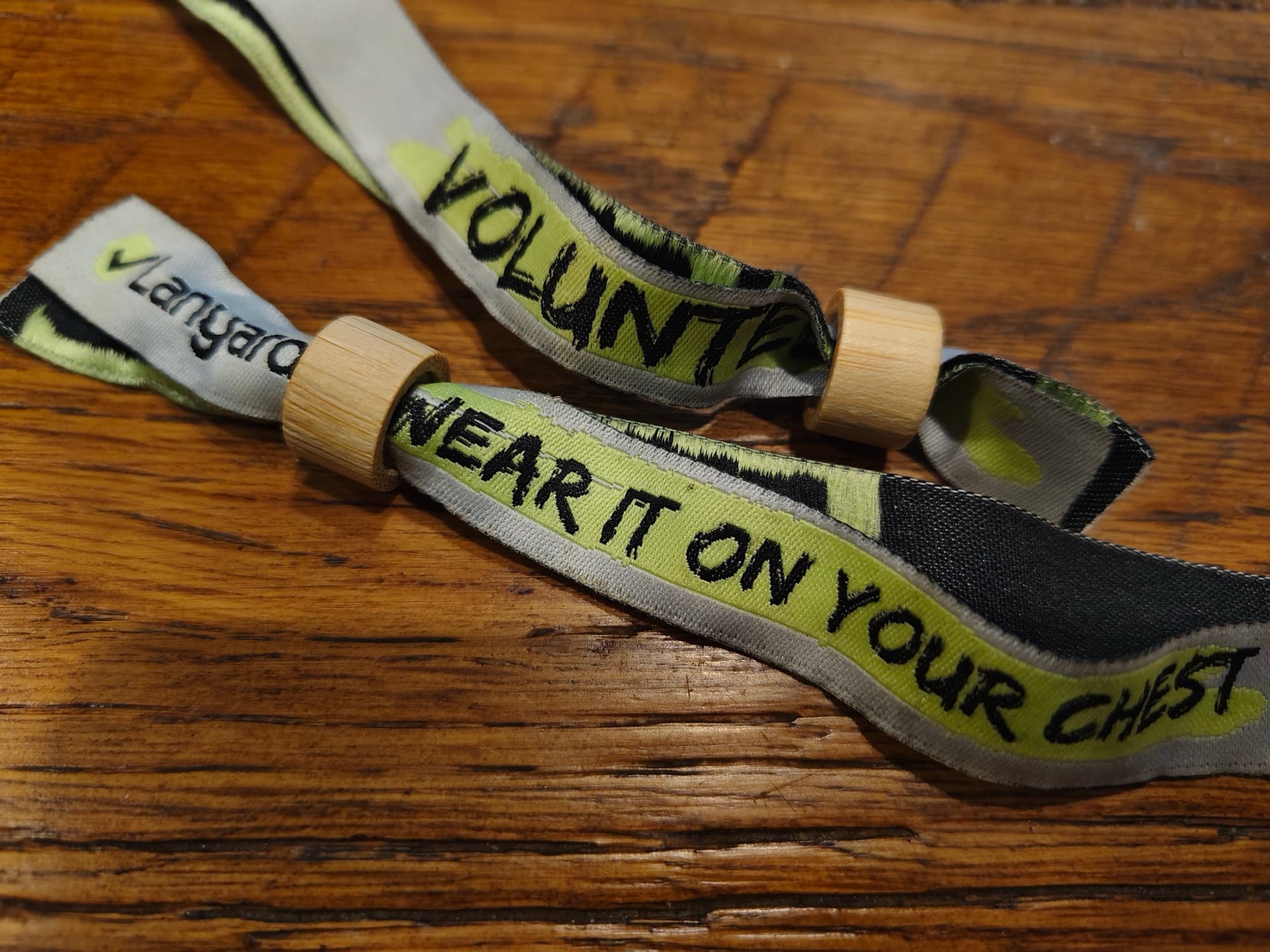 Woven Slipshod volunteer wristbands reading “wear it on your chest”